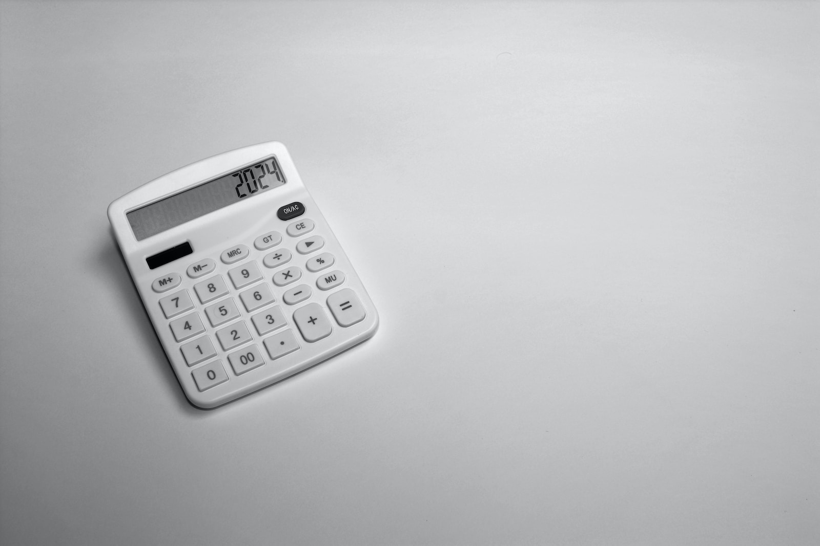 a white calculator sitting on top of a table